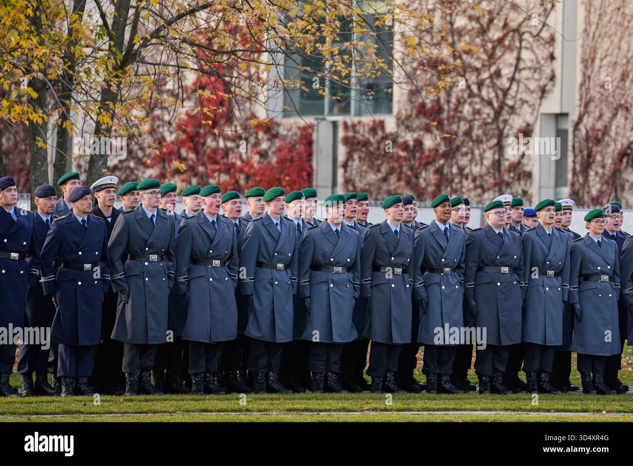 Soldiers take part in the ceremonial pledge as a central event to mark ...