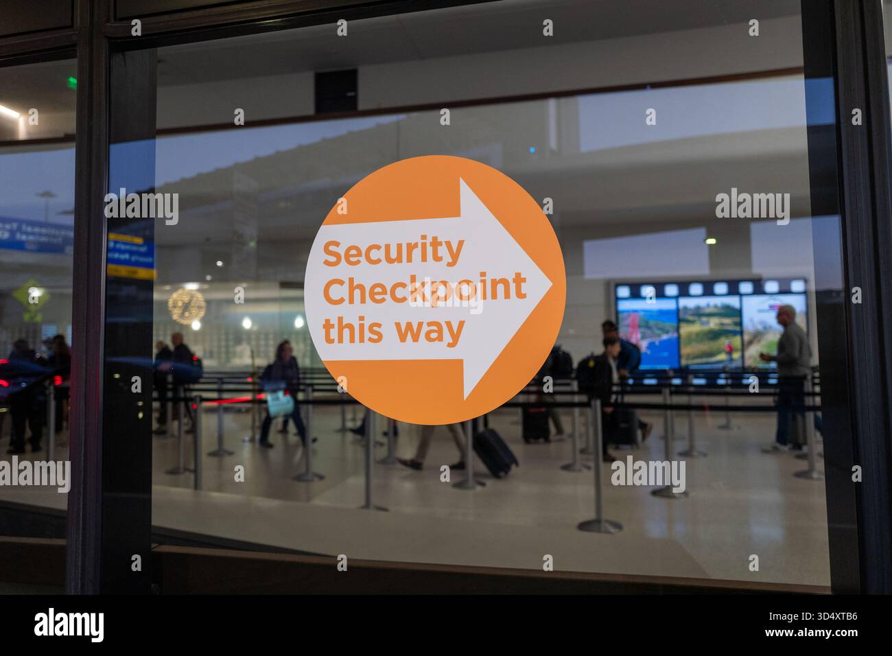 Directional sign with arrow and text reading Security Checkpoint This ...