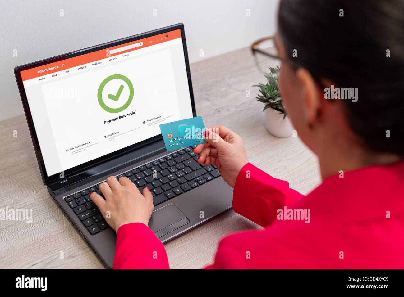 Picture of Woman completing online payment hi-res stock photography and images - Alamy