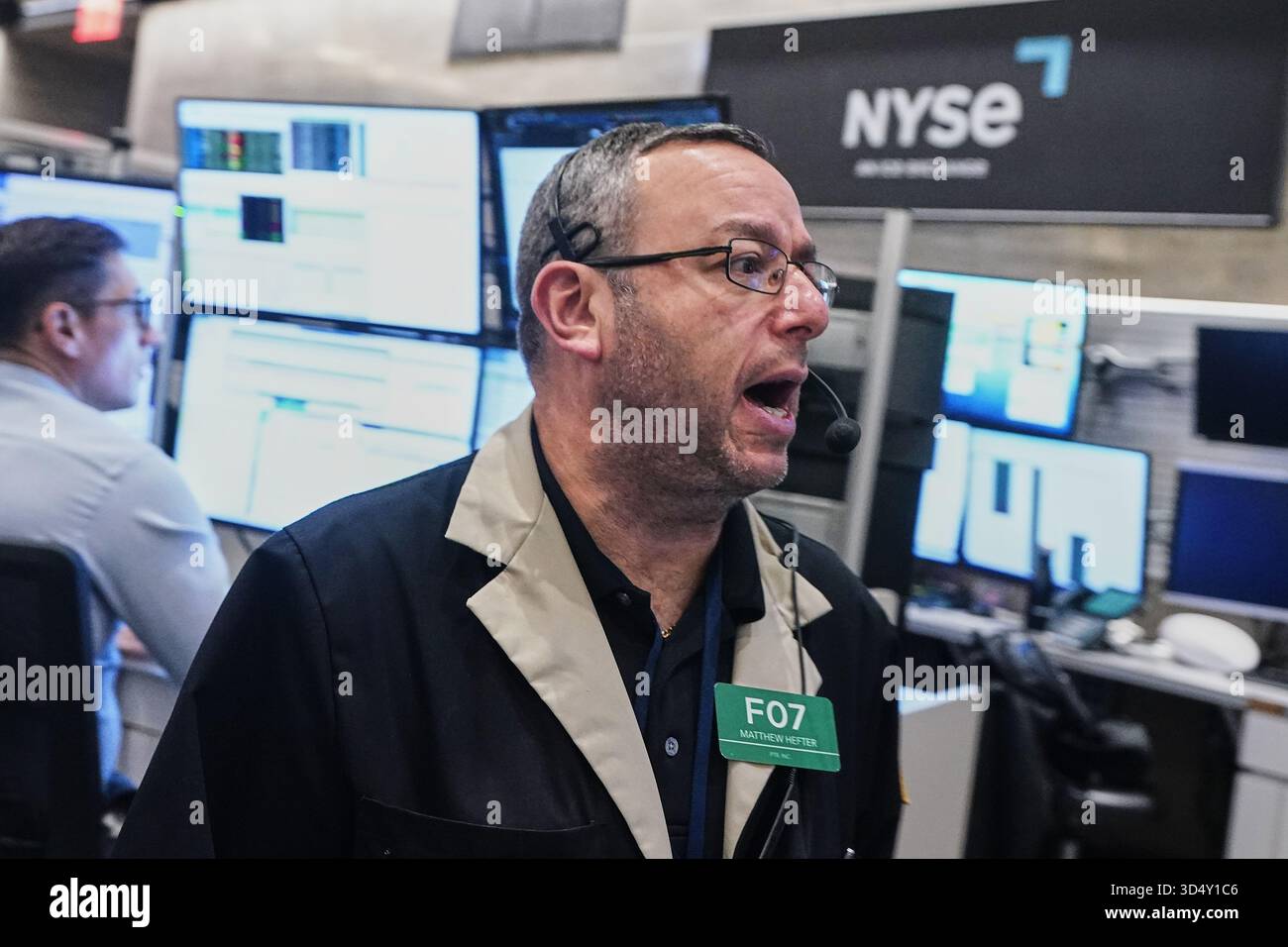 Options trader Matthew Hefter works on the floor of the New York Stock ...