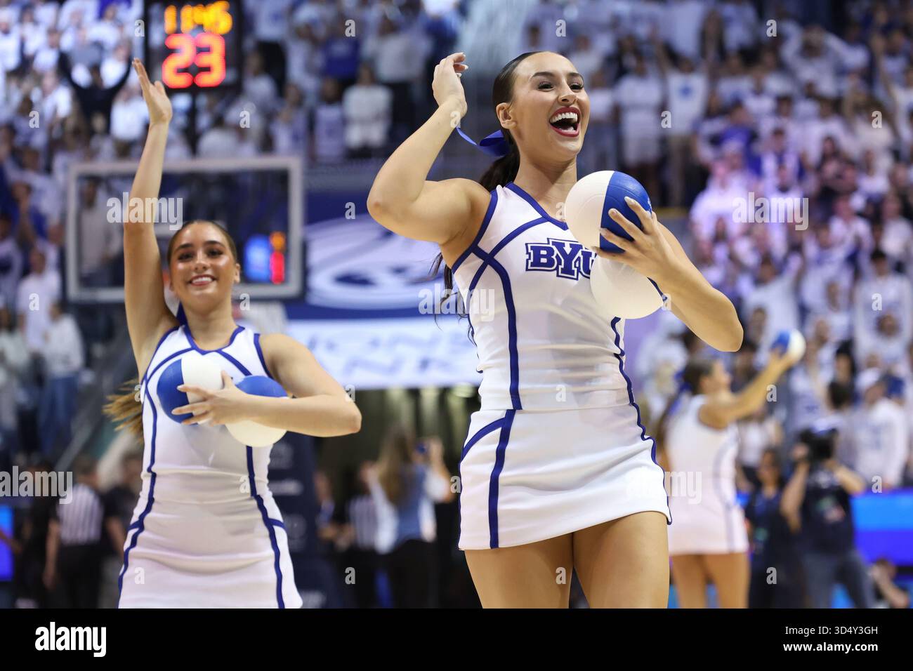 BYU cheerleaders perform during an NCAA college basketball game Tuesday ...
