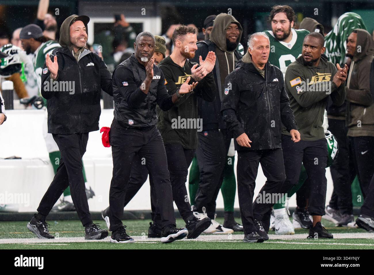 New York Jets head coach Aaron Glenn, second from right, reacts to the ...