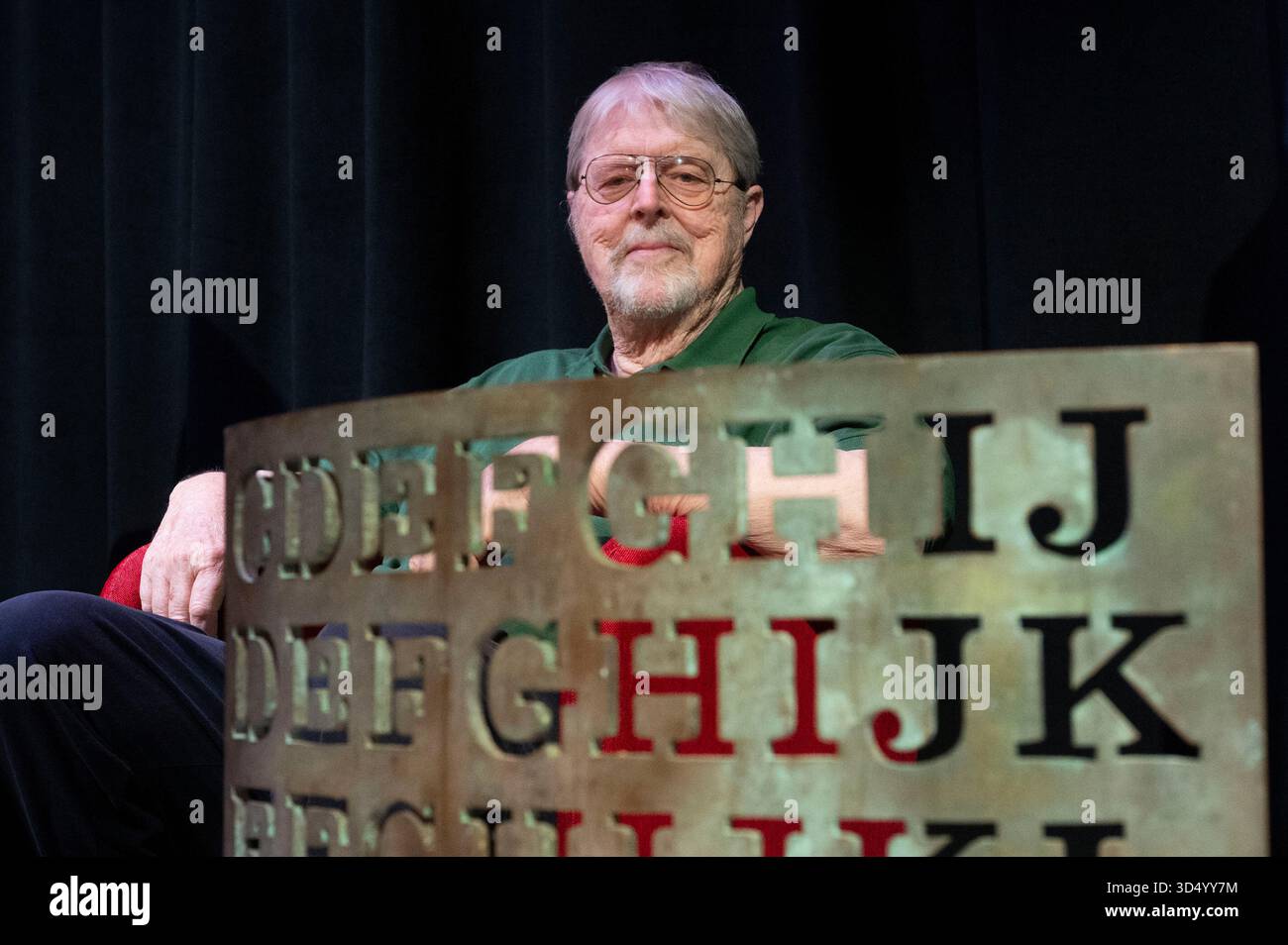 Artist Jim Sanborn sits behind a proof of concept piece for the Kryptos ...
