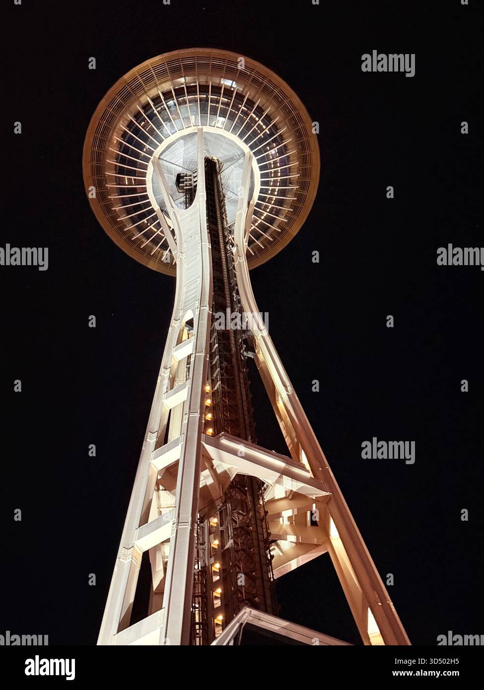 The Seattle Space Needle at a twilight hour, illuminated only by the light coming from itself. - Smartphone Captured Stock Image