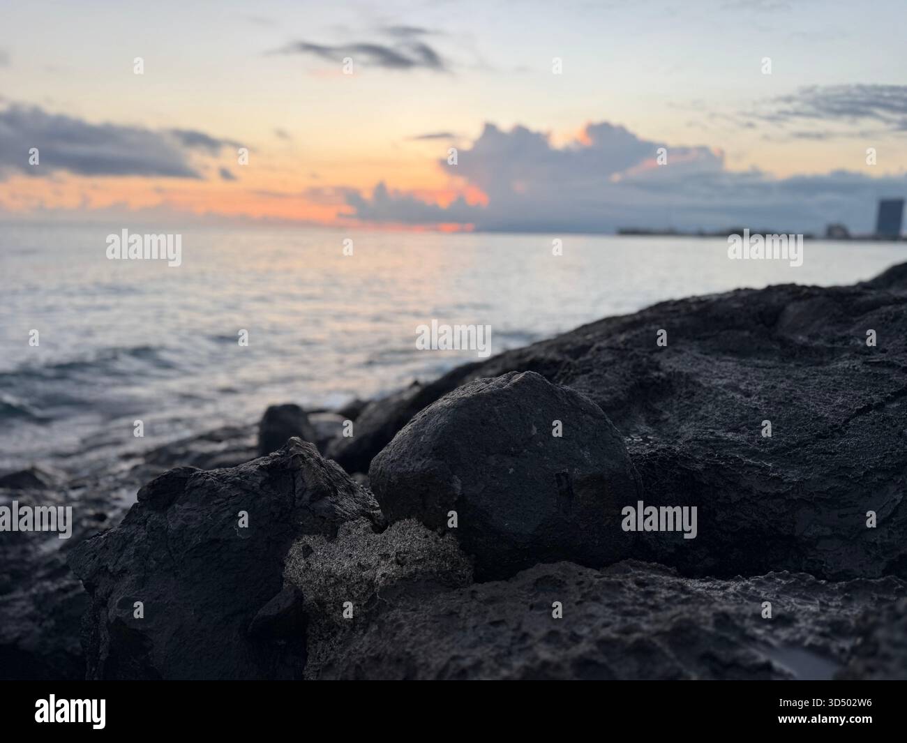 A calm sunset on Hawaiian rocks - Smartphone Captured Stock Image