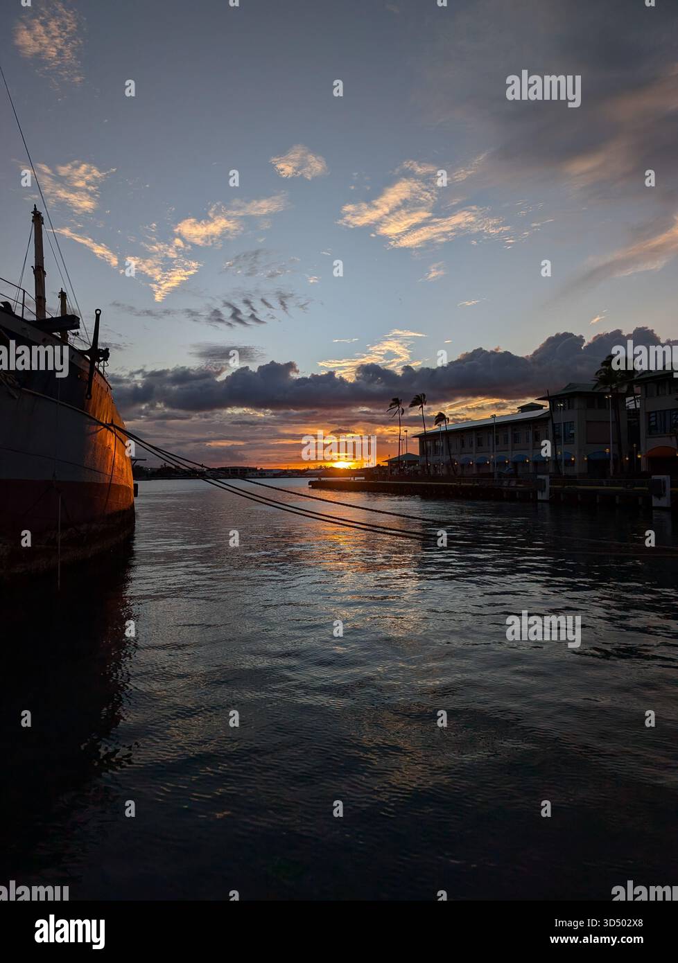 A fire in the sky at a Hawaiian harbor - Smartphone Captured Stock Image