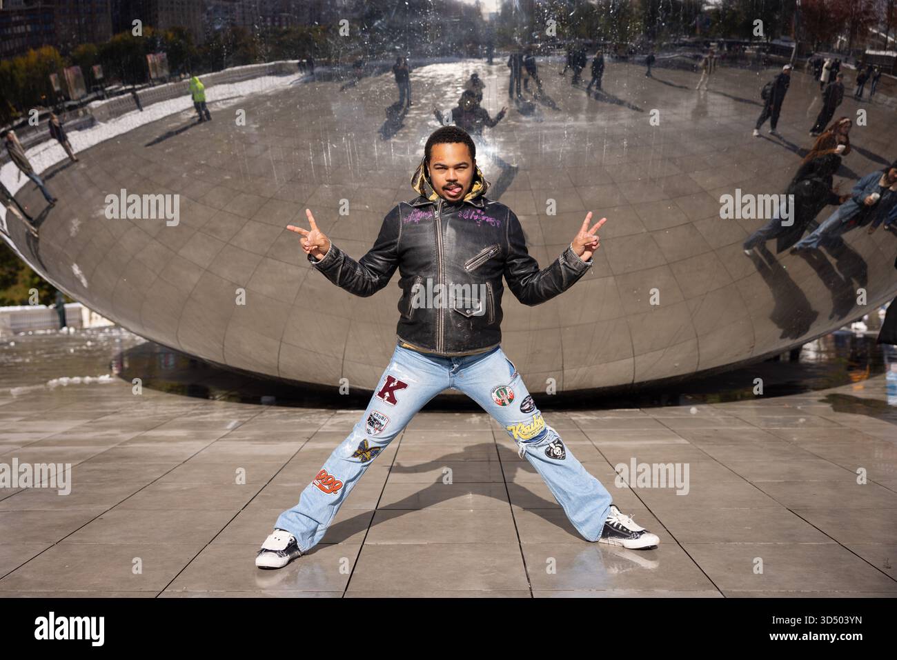Chicago rapper Adamn Killa stands in front of The Bean at Millennium ...