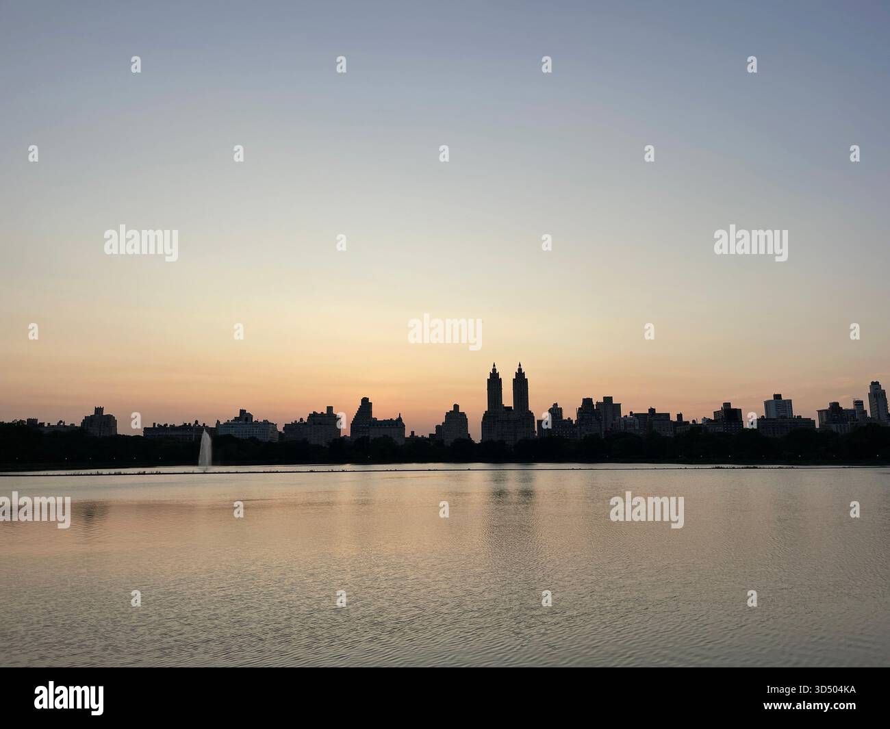 Tranquil reflections in the misty waters of Central Park’s Reservoir. - Smartphone Captured Stock Image