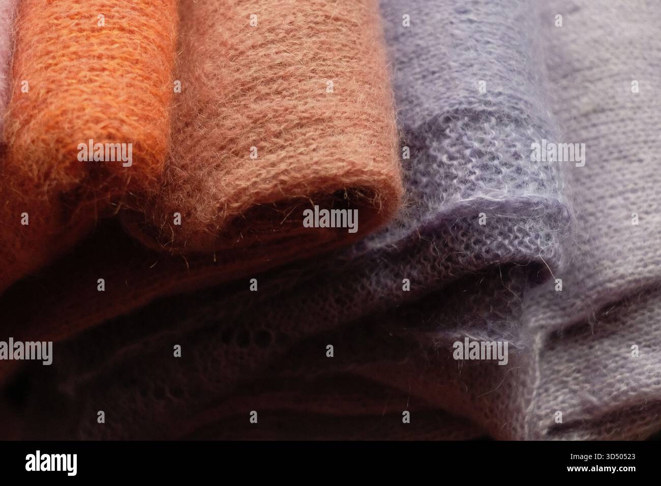 knitted sweaters in different colours Stock Photo