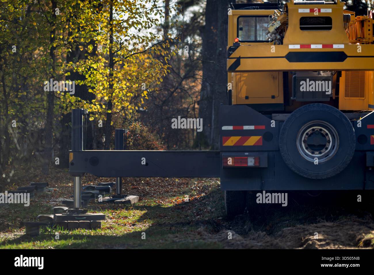 The rear left side of the truck crane prepared for work Stock Photo - Alamy