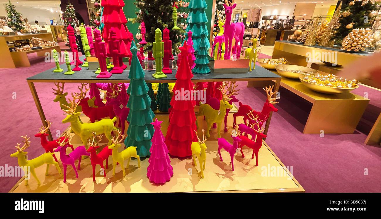 Berlin, Germany - September 19, 2025: Colorful holiday decorations feature vibrant trees and reindeer in a festive setting. - Smartphone Captured Stock Image