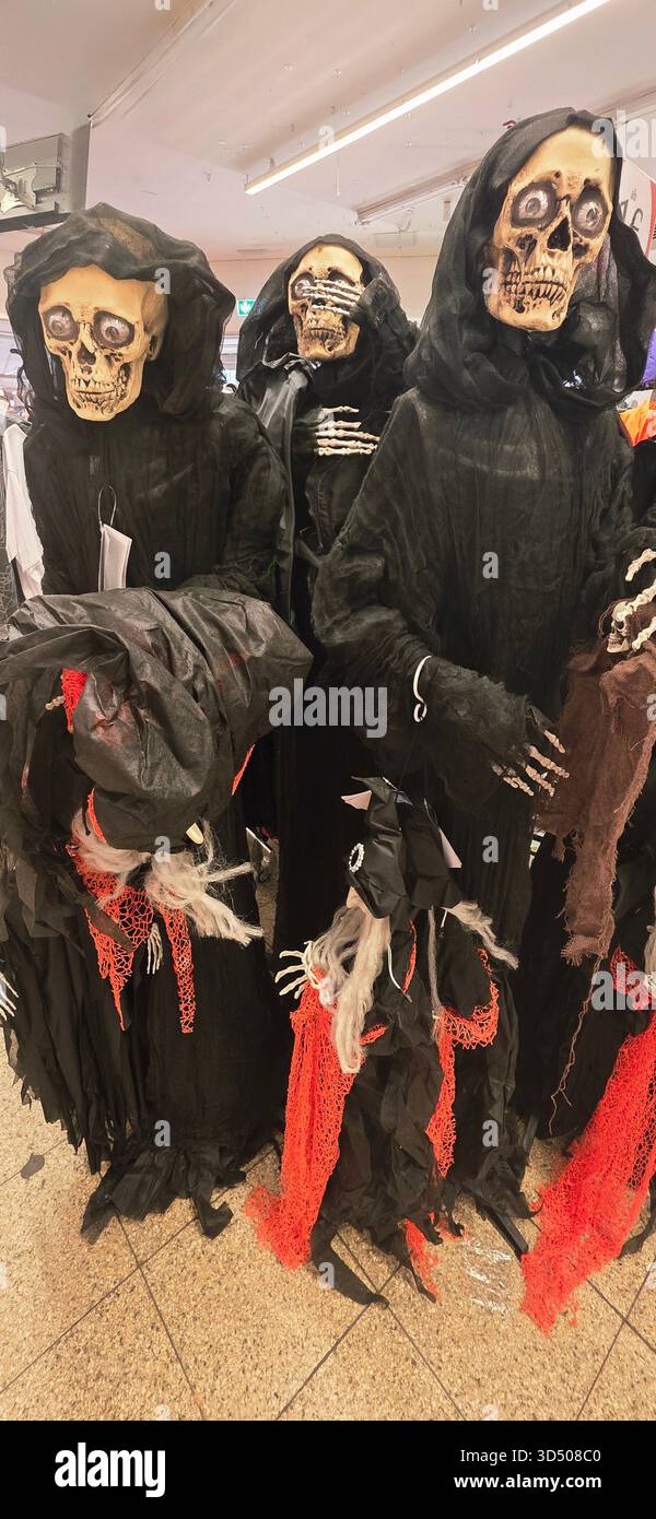 Berlin, Germany - September 25, 2025: Halloween skeleton decorations in dark cloaks create a spooky atmosphere for festive events. - Smartphone Captured Stock Image