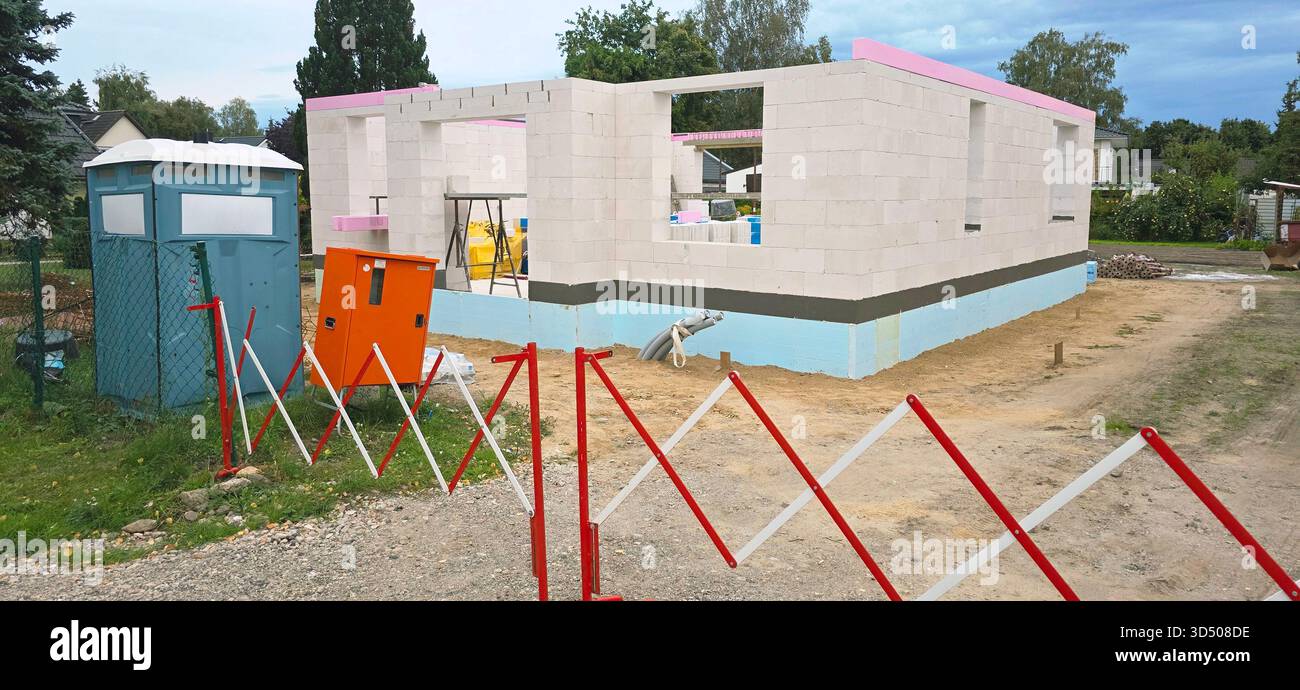Berlin, Germany - September 25, 2025: Construction area features an incomplete building with safety barriers visible. - Smartphone Captured Stock Image