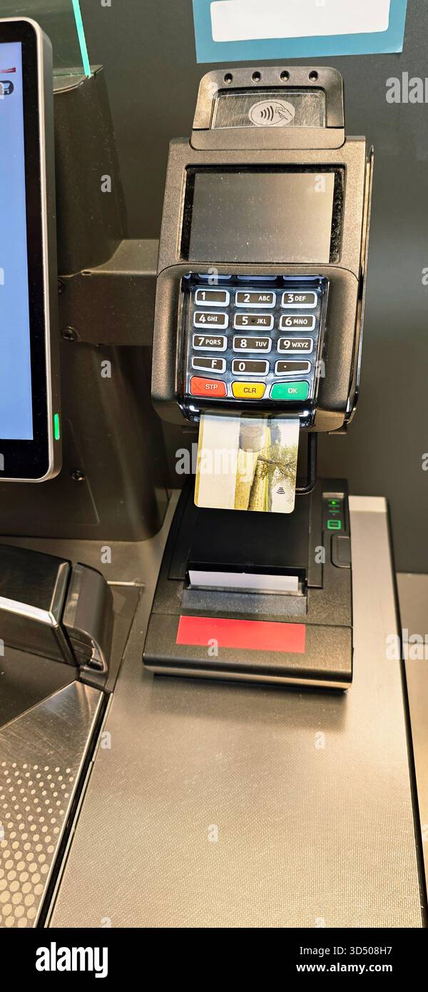 Berlin, Germany - September 27, 2025: Payment terminal displays cash and card reader at self-checkout station. - Smartphone Captured Stock Image