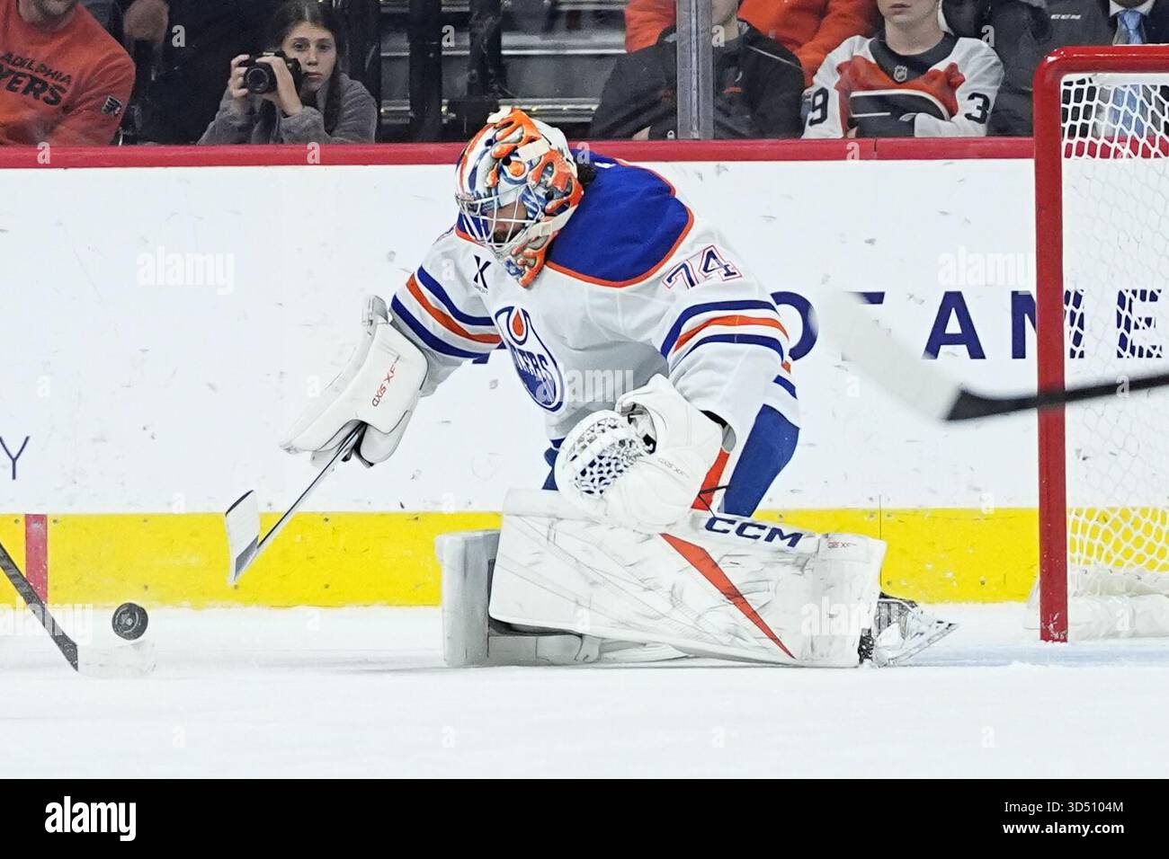 Edmonton Oilers goaltender Stuart Skinner defects the puck during the ...