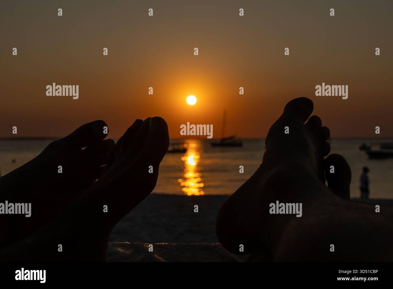 Feets Sunset Relaxing with a view of the beautiful sunset over the Indian Ocean with ...