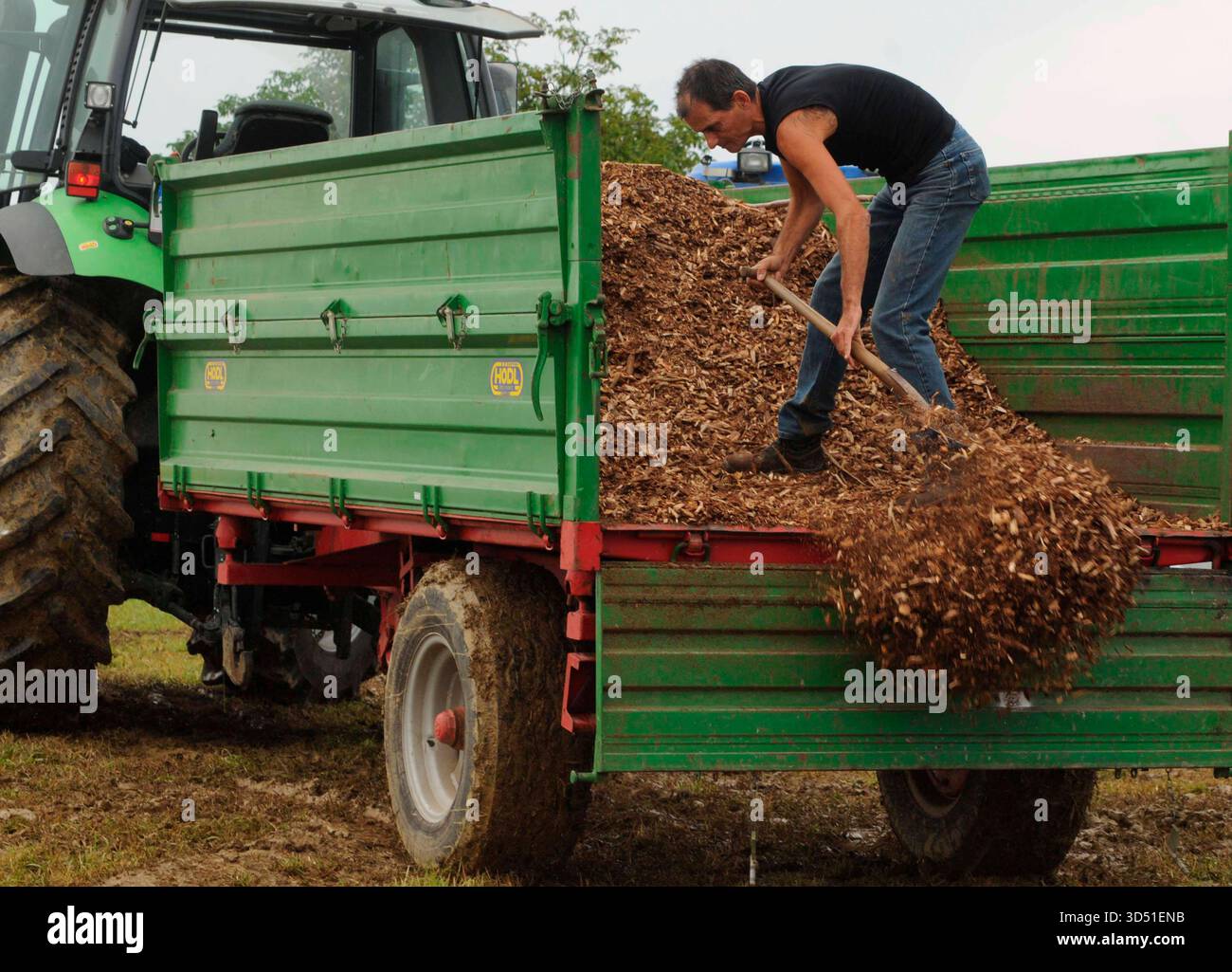 farmer with tractor on the field, agriculture work with machinery ...