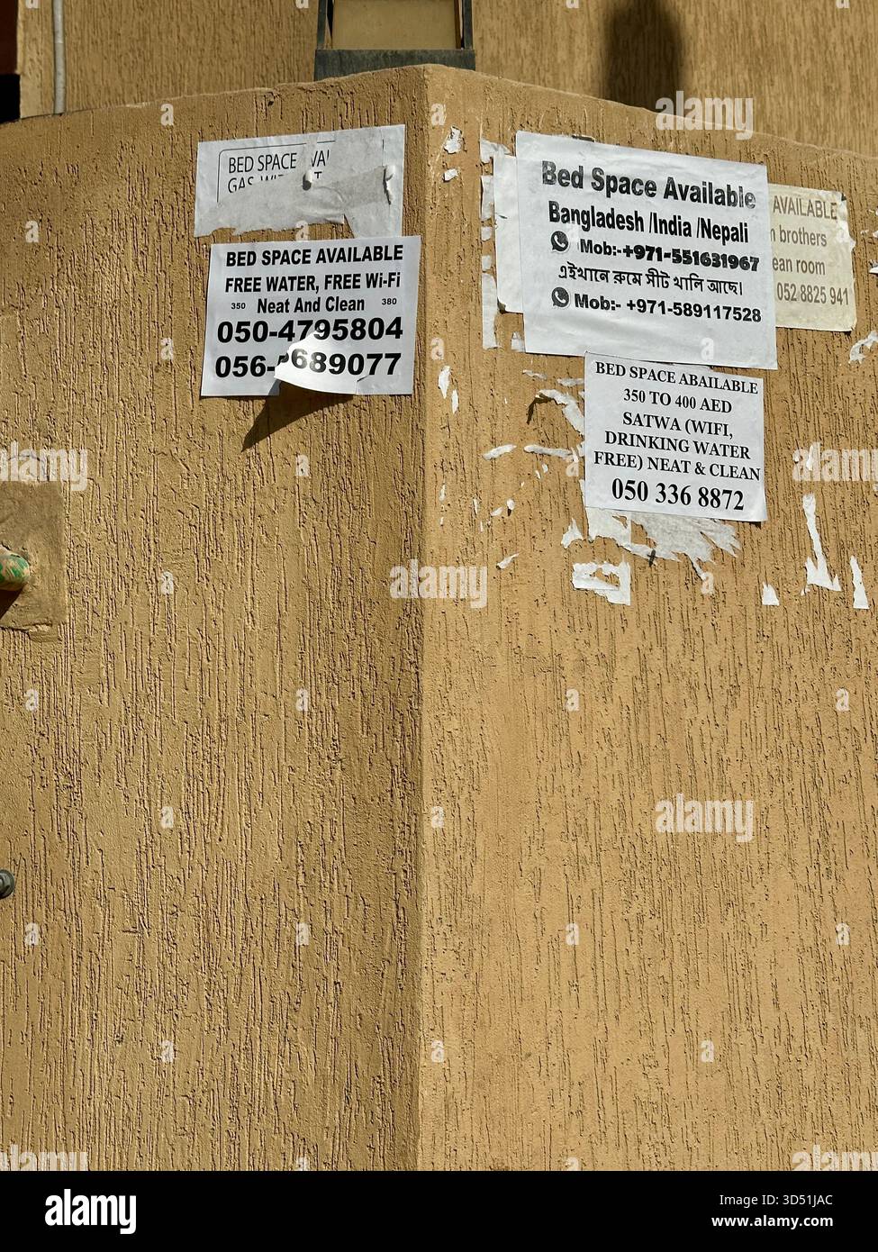 Accommodation posters on wall in al sat dubai Stock Photo