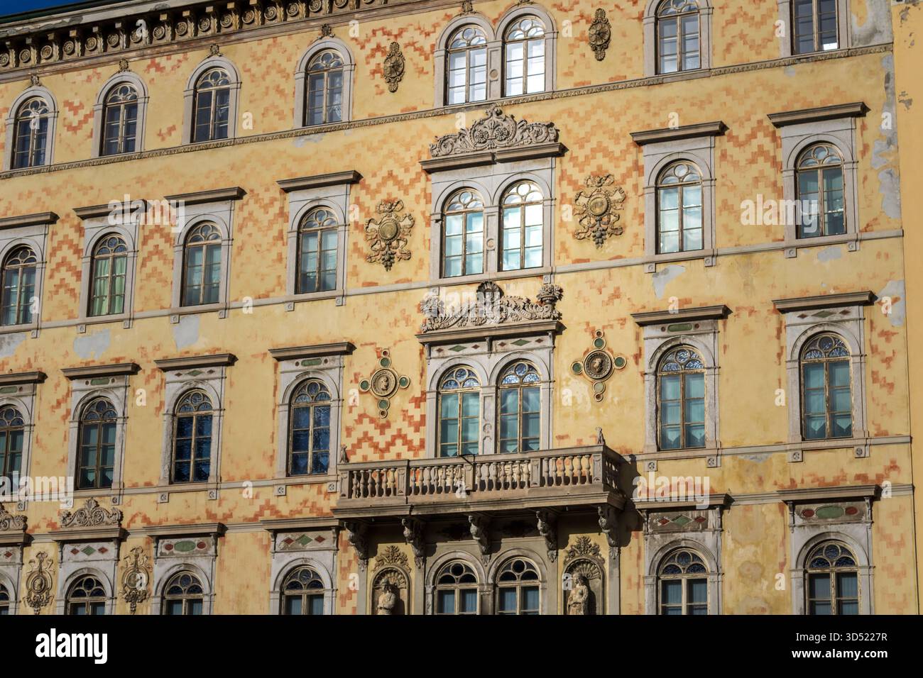 ornate historic building facade with arched windows and balcony Stock ...