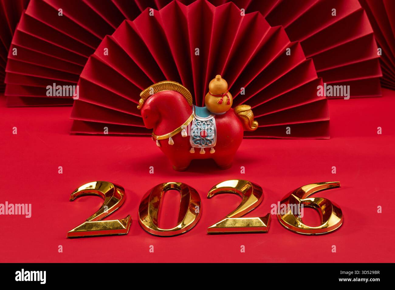 Year of the Horse 2026. Red horse figurine and gold 2026 on red fan ...