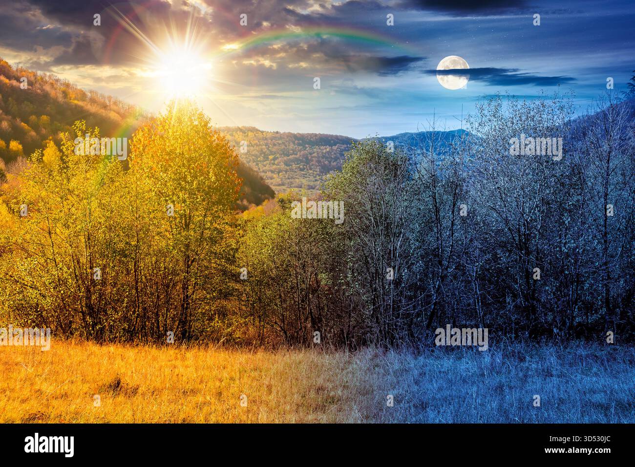 mountain landscape with forest on autumn equinox. day and night time change concept. nature park with birch trees in colorful foliage with sun and moo Stock Photo