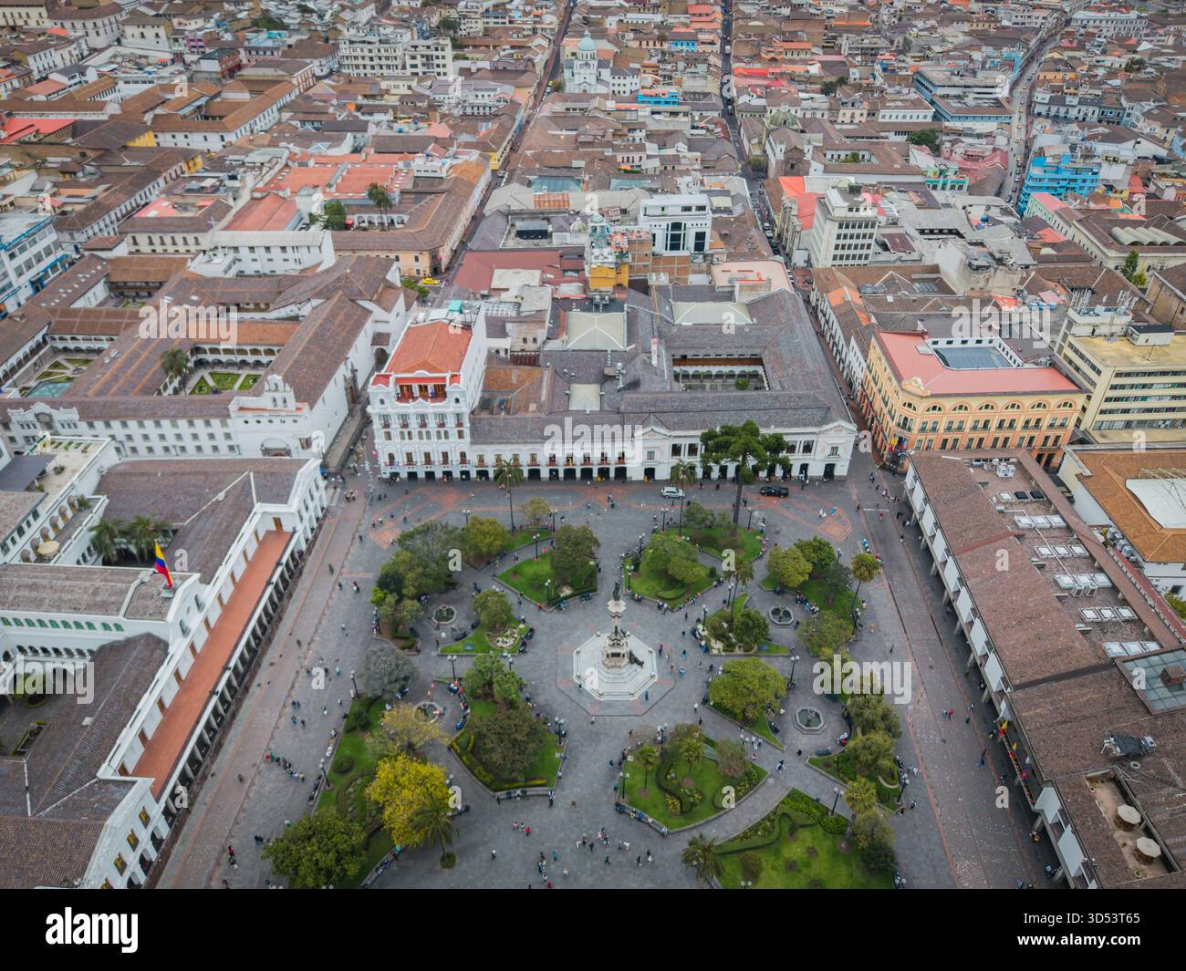Aerial view of a vibrant plaza teeming with life, framed by colonial architecture under the Ecuadorian sun, Quito, Ecuador. Stock Photo
