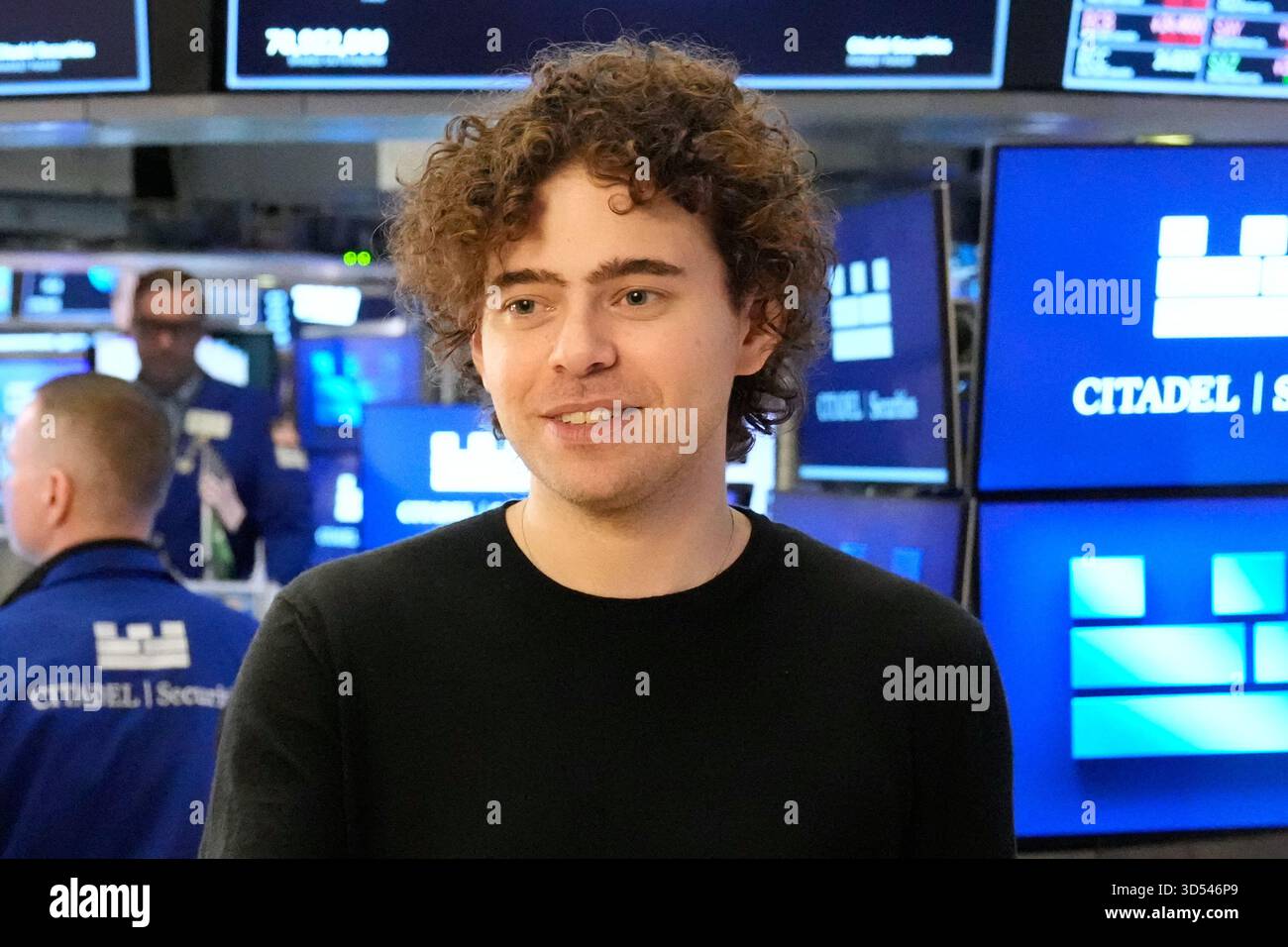 PolyMarket CEO Shayne Coplan walks on the floor of the New York Stock ...