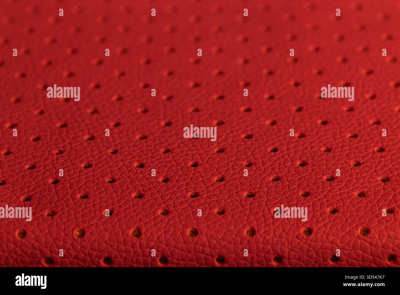 Close Up Red Leatherette Perforated Texture Background Stock Photo