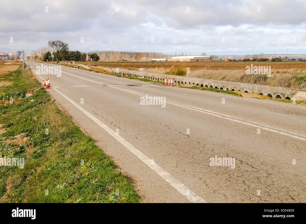 Old road under construction with roadwork signs in the countryside ...