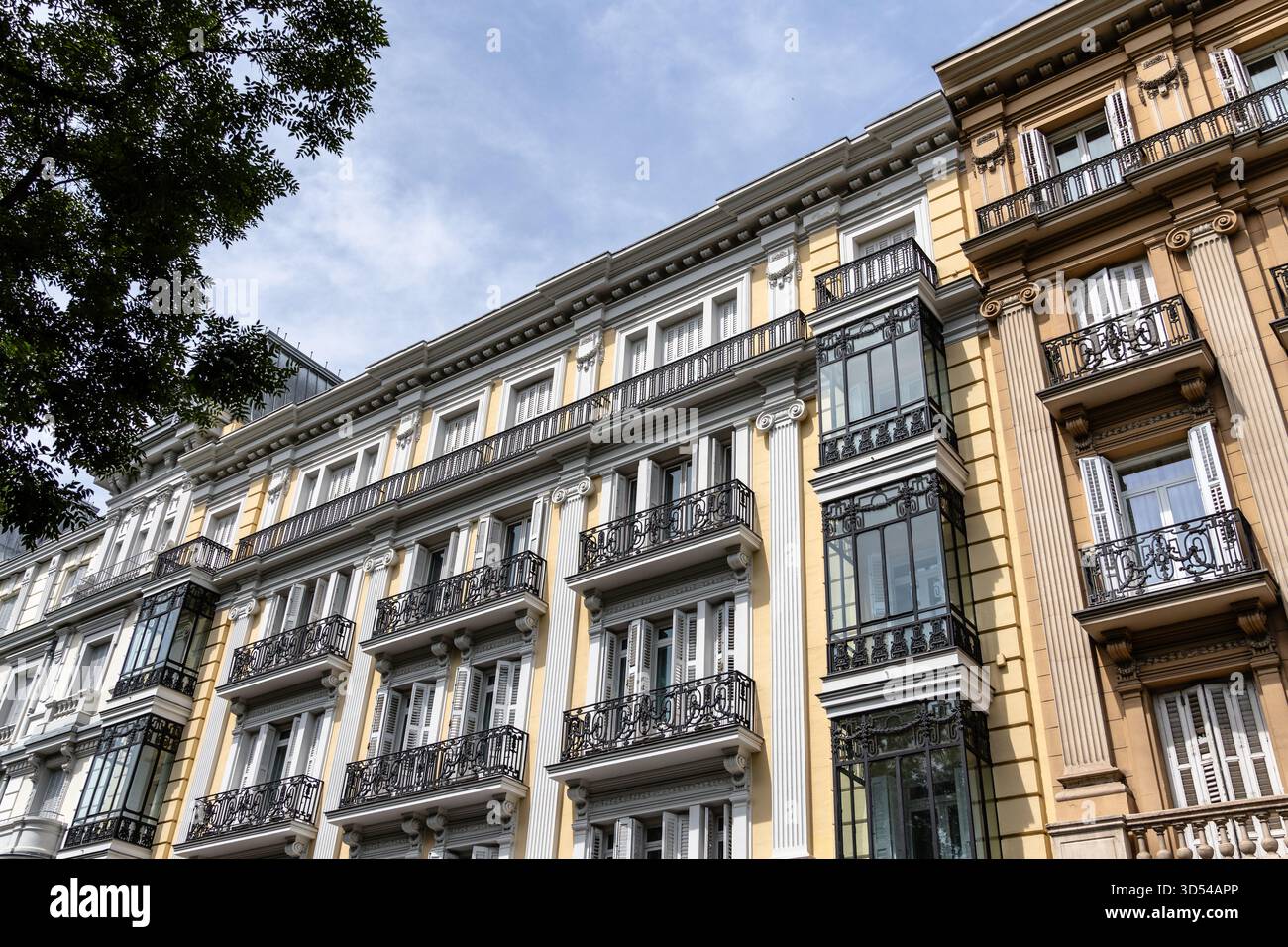 The image captures the facade of classic buildings in Madrid Castellana ...
