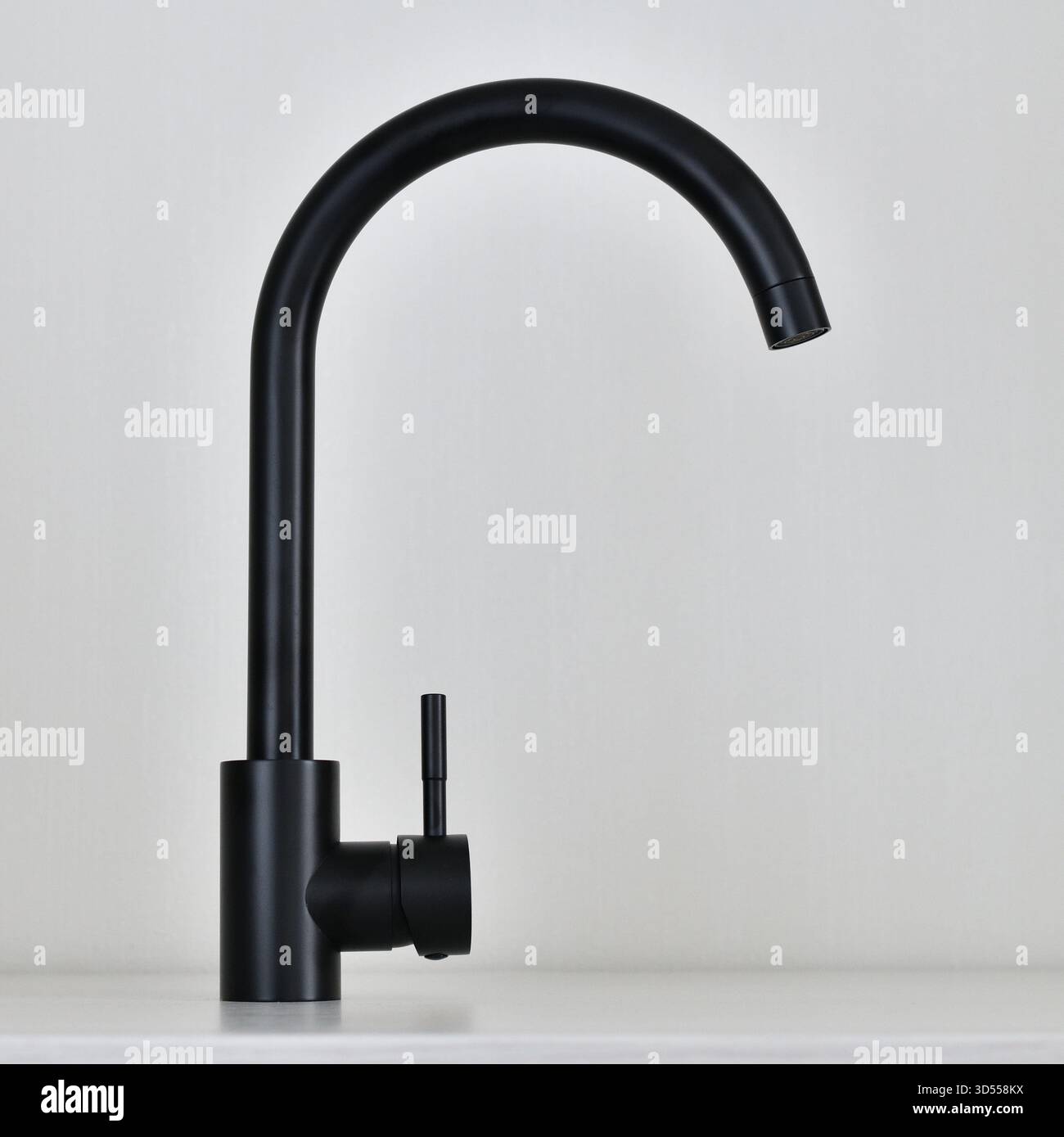 Black single-lever mixer tap on light background Stock Photo
