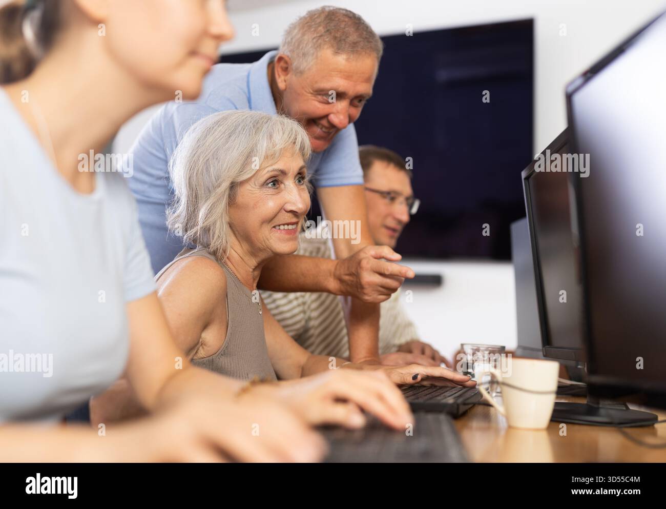 Group of older people studying on computer course Stock Photo