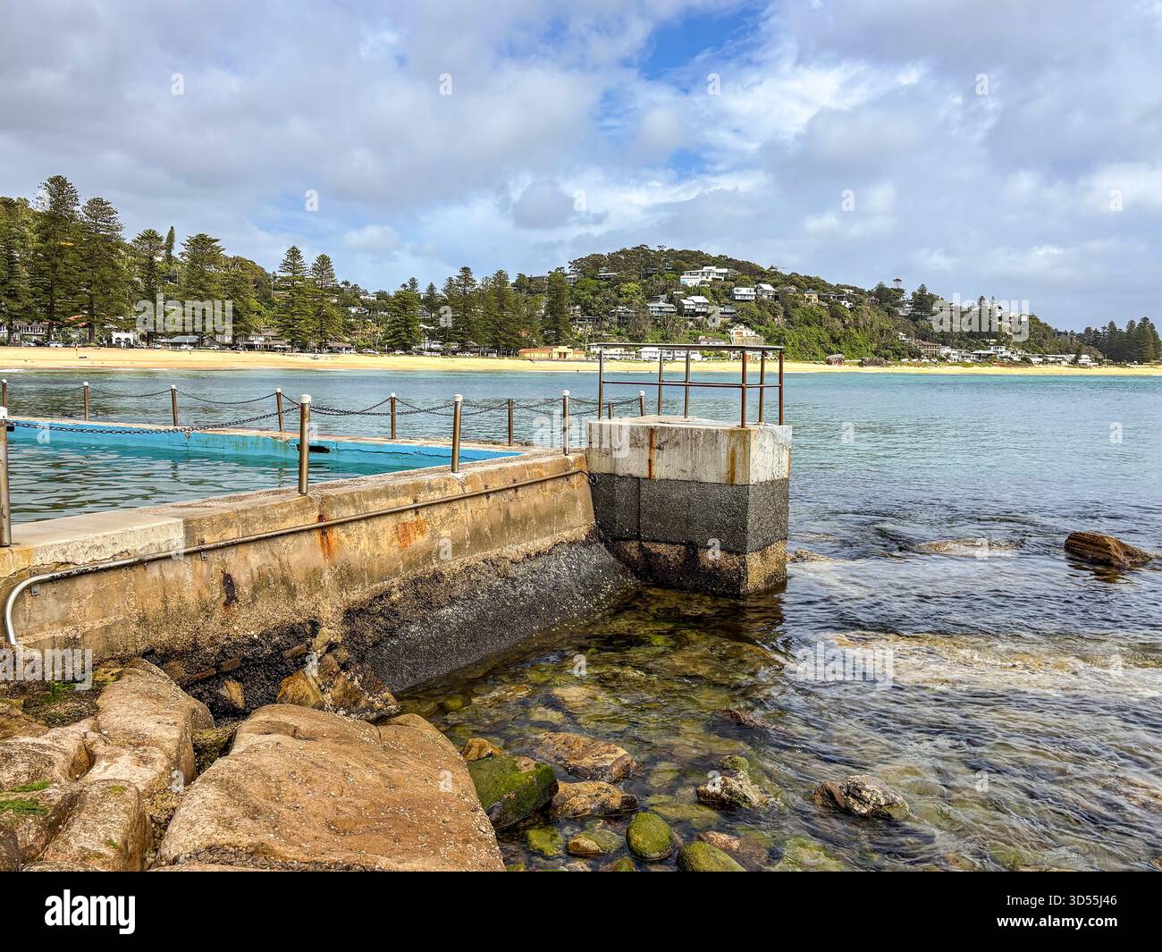 Palm Beach suburb in Sydney, Australia, view of Palm Beach ocean rockpool swimming pool and surrounding beach and coastline, Australia - Smartphone Captured Stock Image