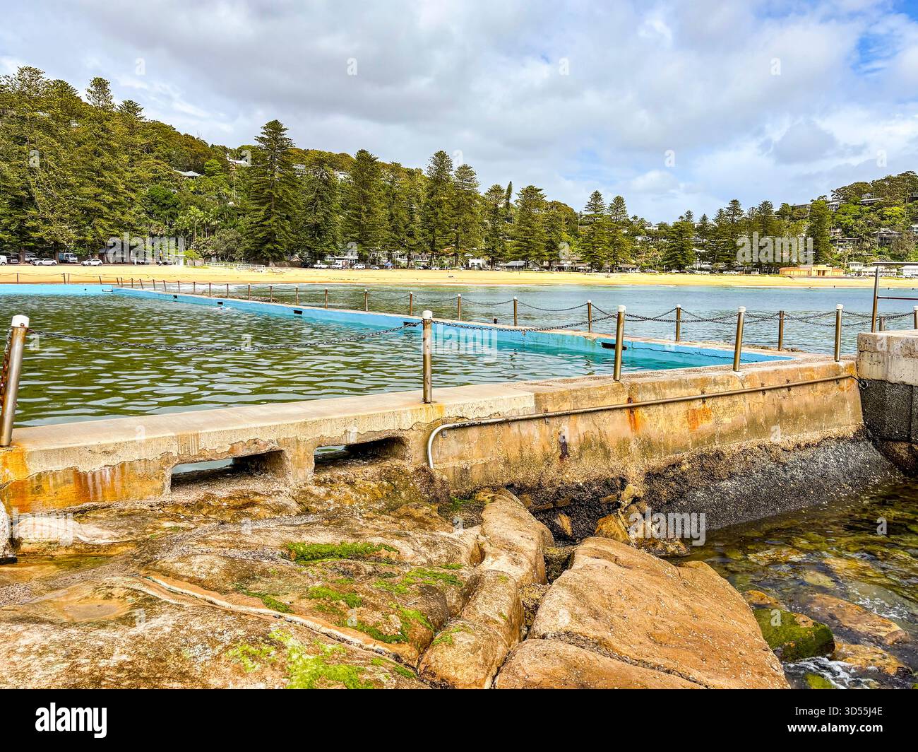 Palm Beach suburb in Sydney, Australia, view of Palm Beach ocean rockpool swimming pool and surrounding beach and coastline, Australia - Smartphone Captured Stock Image