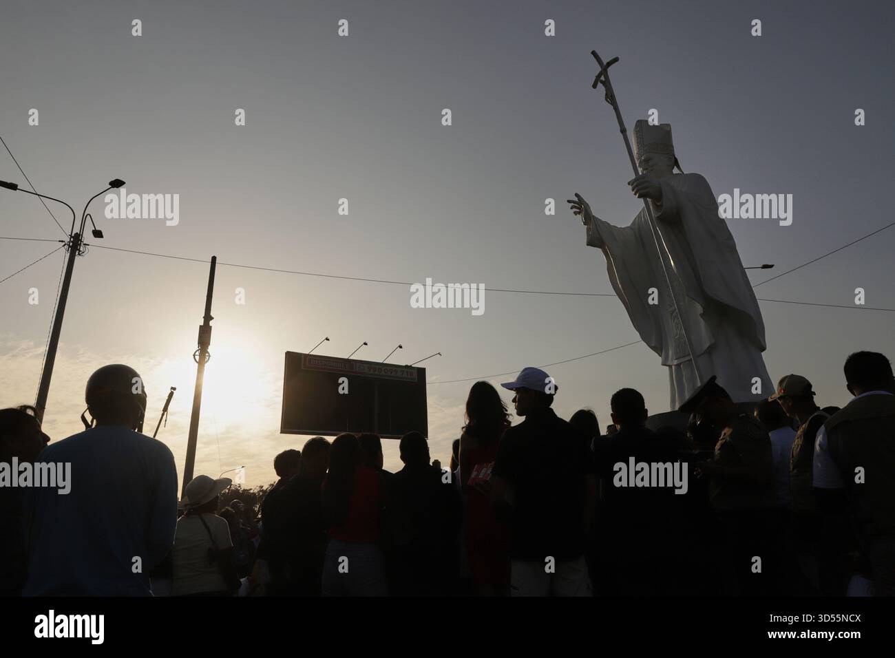 People attend an unveiling ceremony for a statue of Pope Leo XIV in ...
