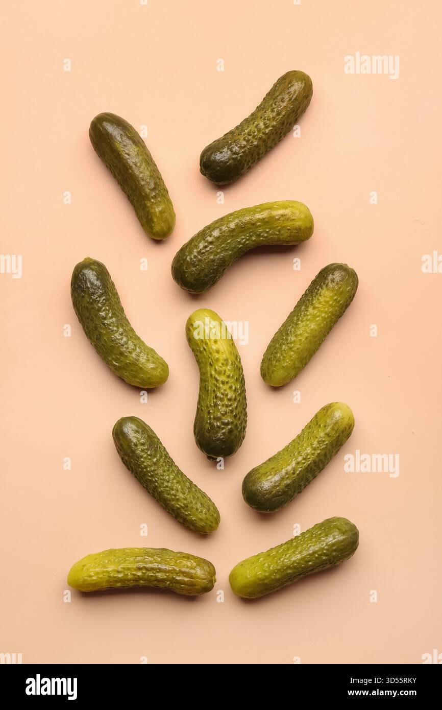 Pickled cucumbers on orange background Stock Photo
