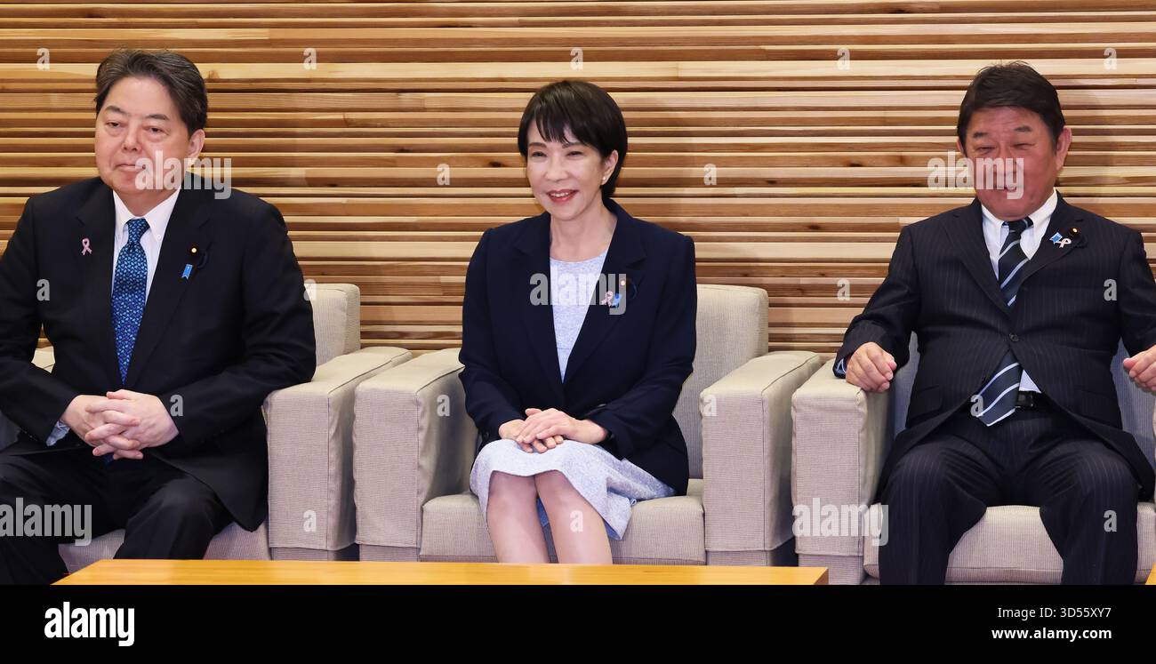 Japanese Prime Minister Sanae Takaichi (C) attends a cabinet meeting at ...