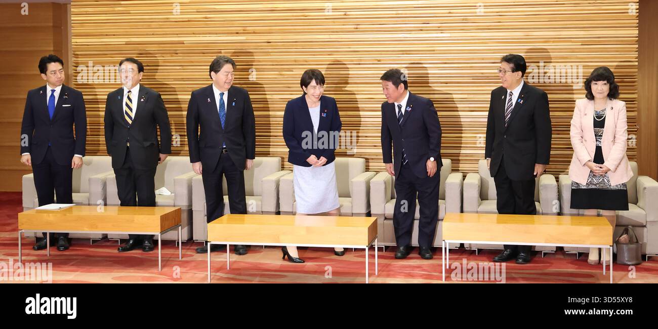 Japanese Prime Minister Sanae Takaichi (C) attends a cabinet meeting at ...