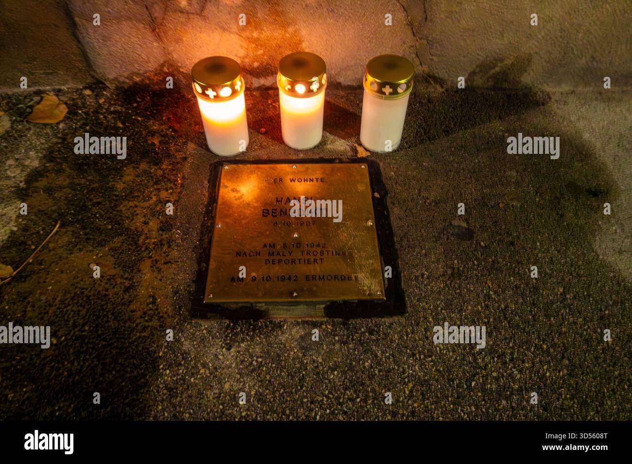 Stolperstein stumbling block in Mondscheingasse Vienna with votive candles Kristallnacht Remembrance Day. Brass plaque memorial to Holocaust victims. Stock Photo