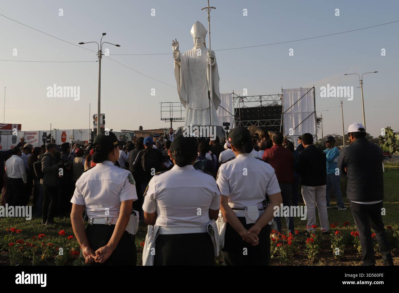 People attend an unveiling ceremony for a statue of Pope Leo XIV in ...