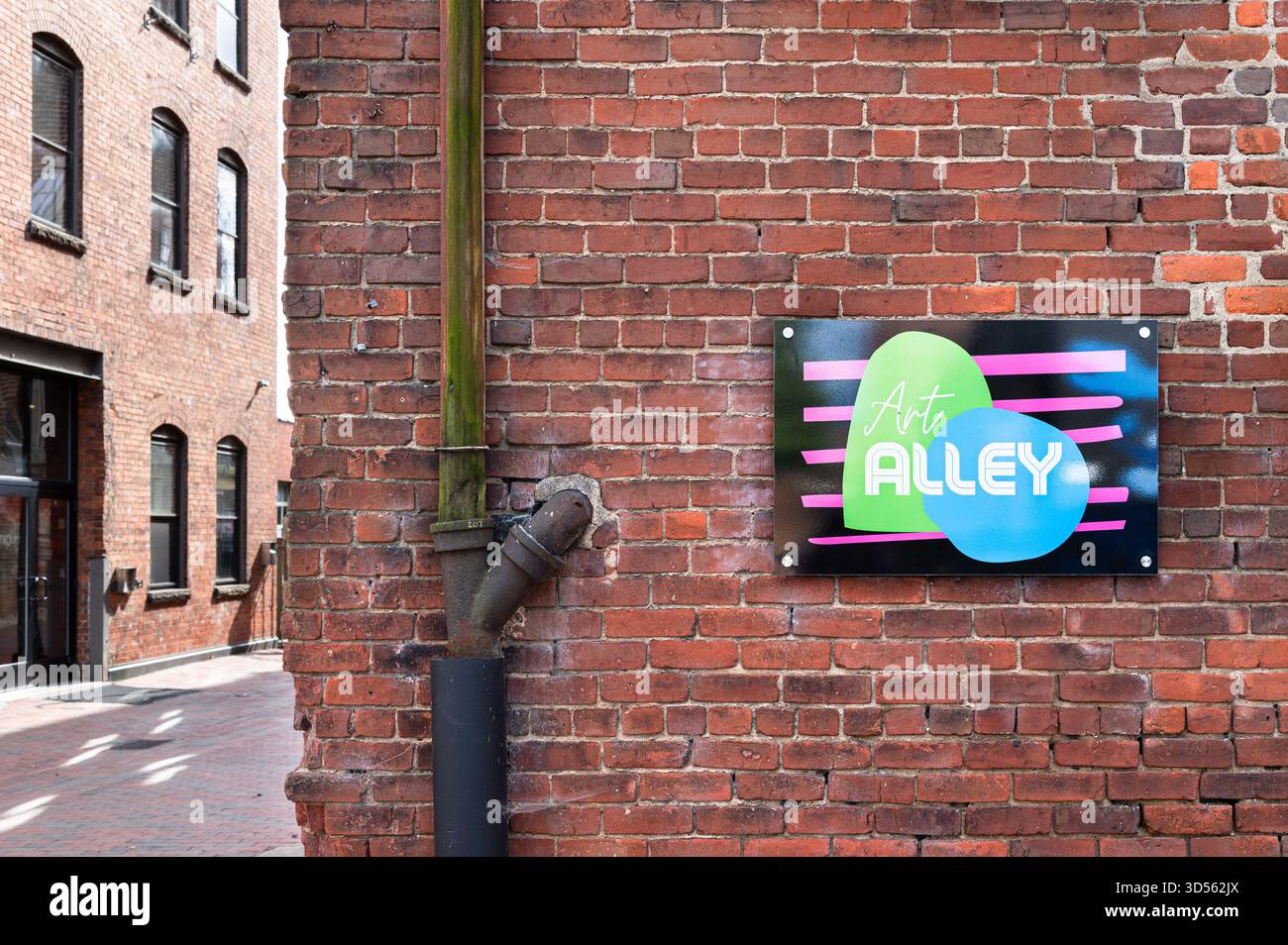 Sign on a brick wall for Art Alley in downtown Lynchburg, Virginia Stock Photo