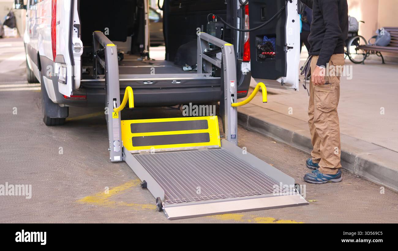 Van wheelchair lift deploying providing accessible transport and inclusion Stock Photo
