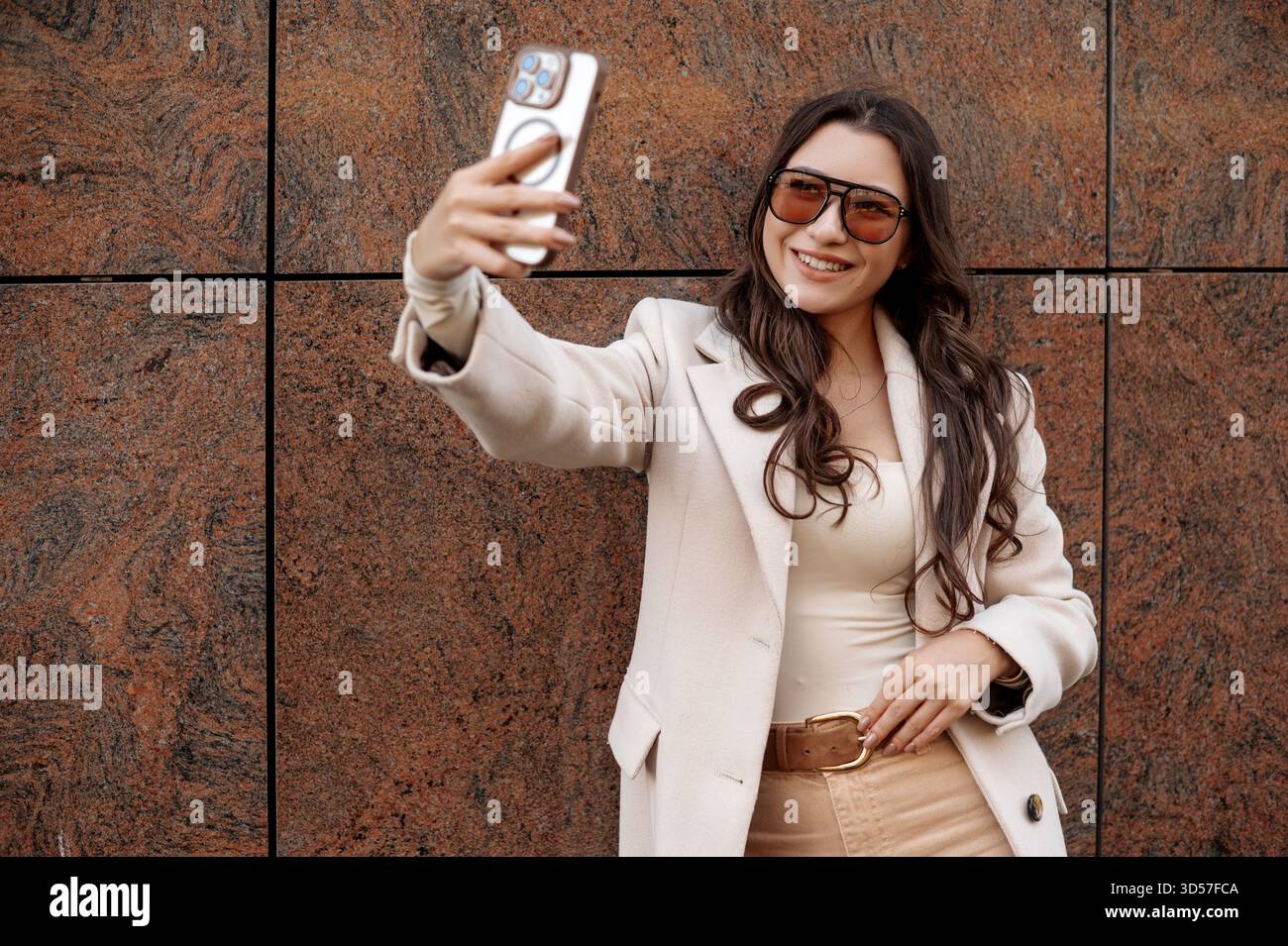 Long beige coat hi-res stock photography and images - Alamy