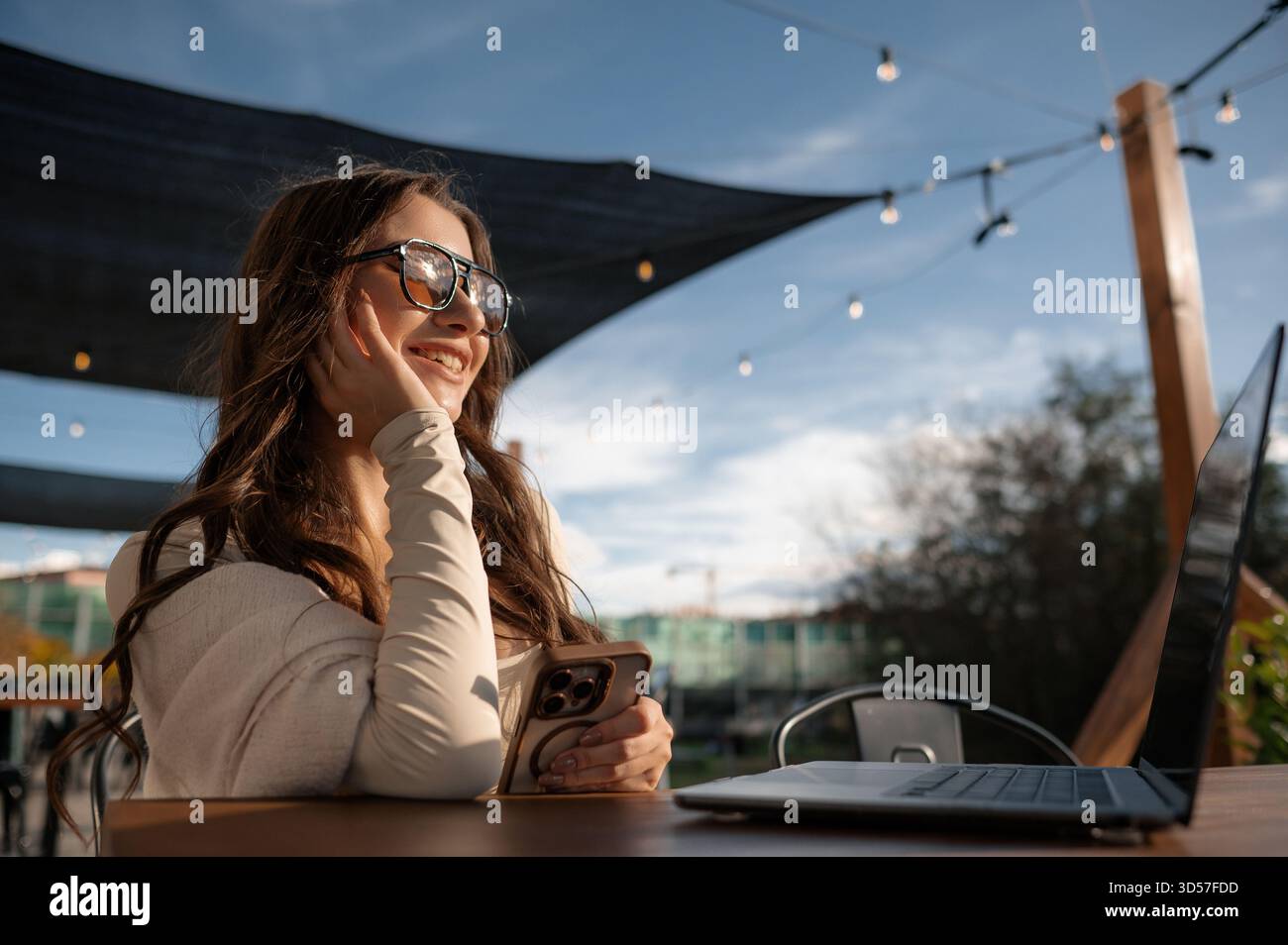 Woman Enjoying Outdoor Workspace with Tech Devices Stock Photo