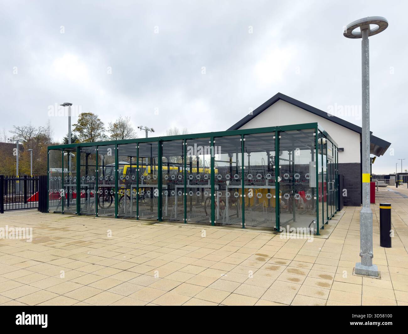 Secured bicycle locker on train station in Headbolt Lane Kirkby Knowsley UK - Smartphone Captured Stock Image