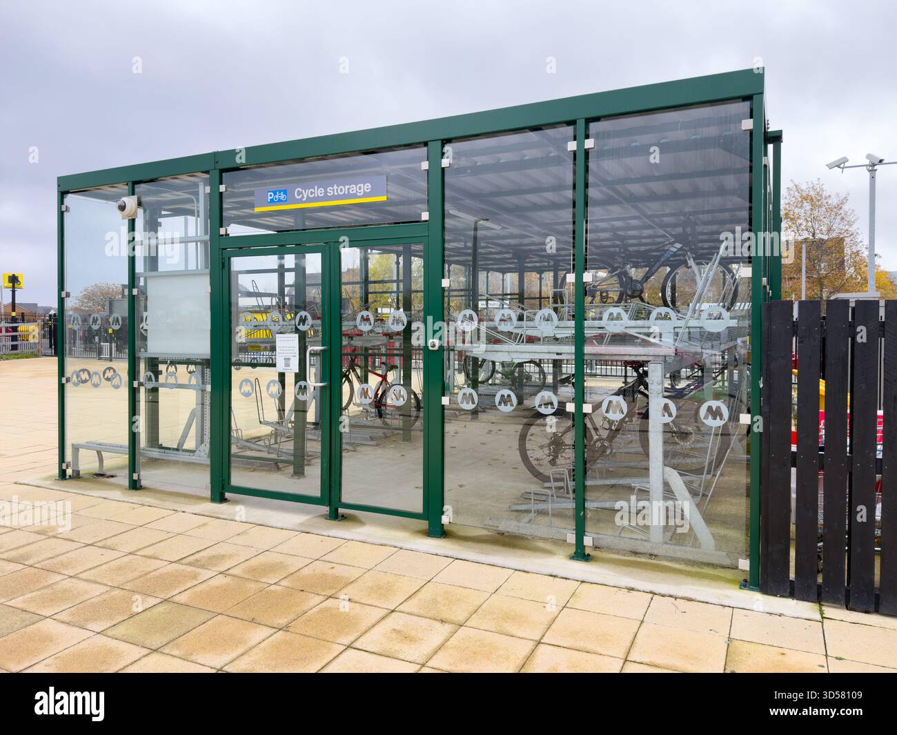Secured bicycle locker on train station in Headbolt Lane Kirkby Knowsley UK - Smartphone Captured Stock Image