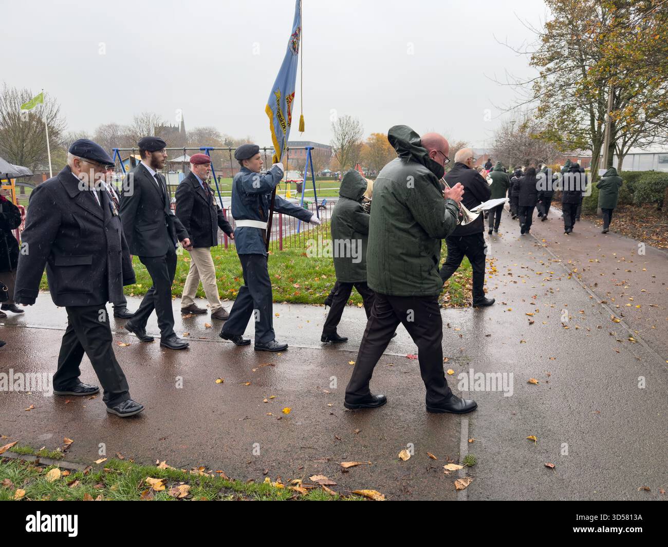 Ormskirk Remembrance Parade, Ormskirk Lancashire UK UK. Despite the pouring rain many people turned out mark the occasion and pay their respects. Nove - Smartphone Captured Stock Image