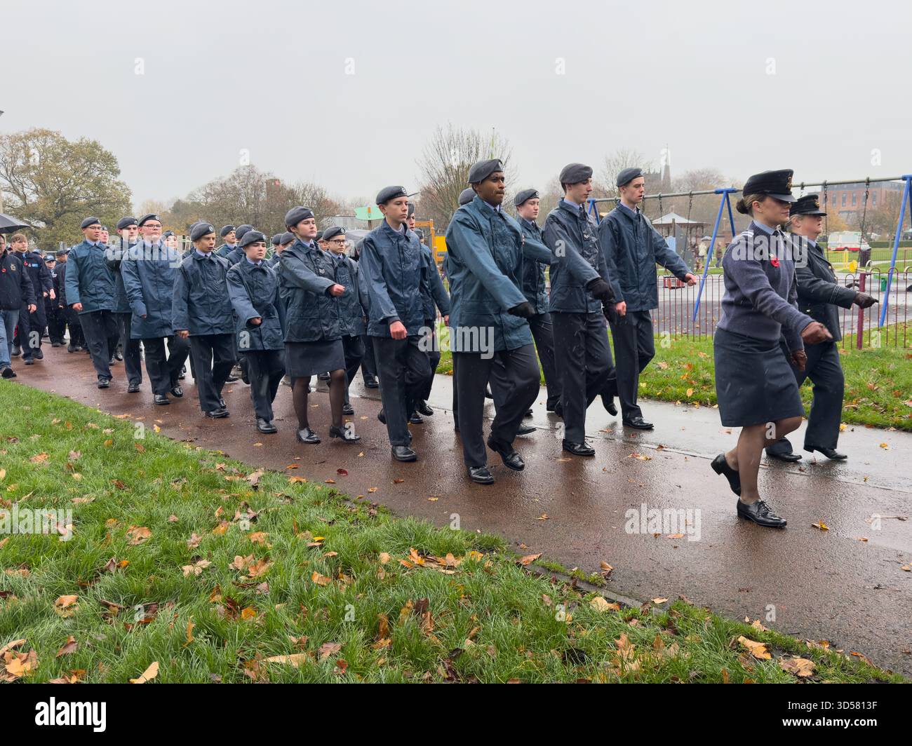 Ormskirk Remembrance Parade, Ormskirk Lancashire UK UK. Despite the pouring rain many people turned out mark the occasion and pay their respects. Nove - Smartphone Captured Stock Image
