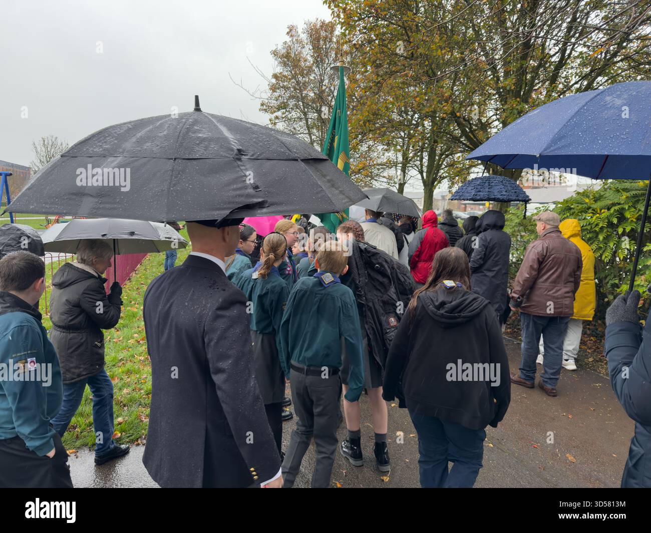 Ormskirk Remembrance Parade, Ormskirk Lancashire UK UK. Despite the pouring rain many people turned out mark the occasion and pay their respects. Nove - Smartphone Captured Stock Image