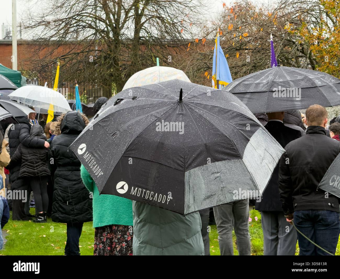 Ormskirk Remembrance Parade, Ormskirk Lancashire UK UK. Despite the pouring rain many people turned out mark the occasion and pay their respects. Nove - Smartphone Captured Stock Image